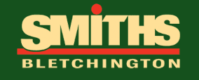 Logo with the word “SMITHS” in large yellow letters, a red dot above the “I,” a red line underneath, and “BLETCHINGTON” in smaller yellow letters below, all on a dark green background.